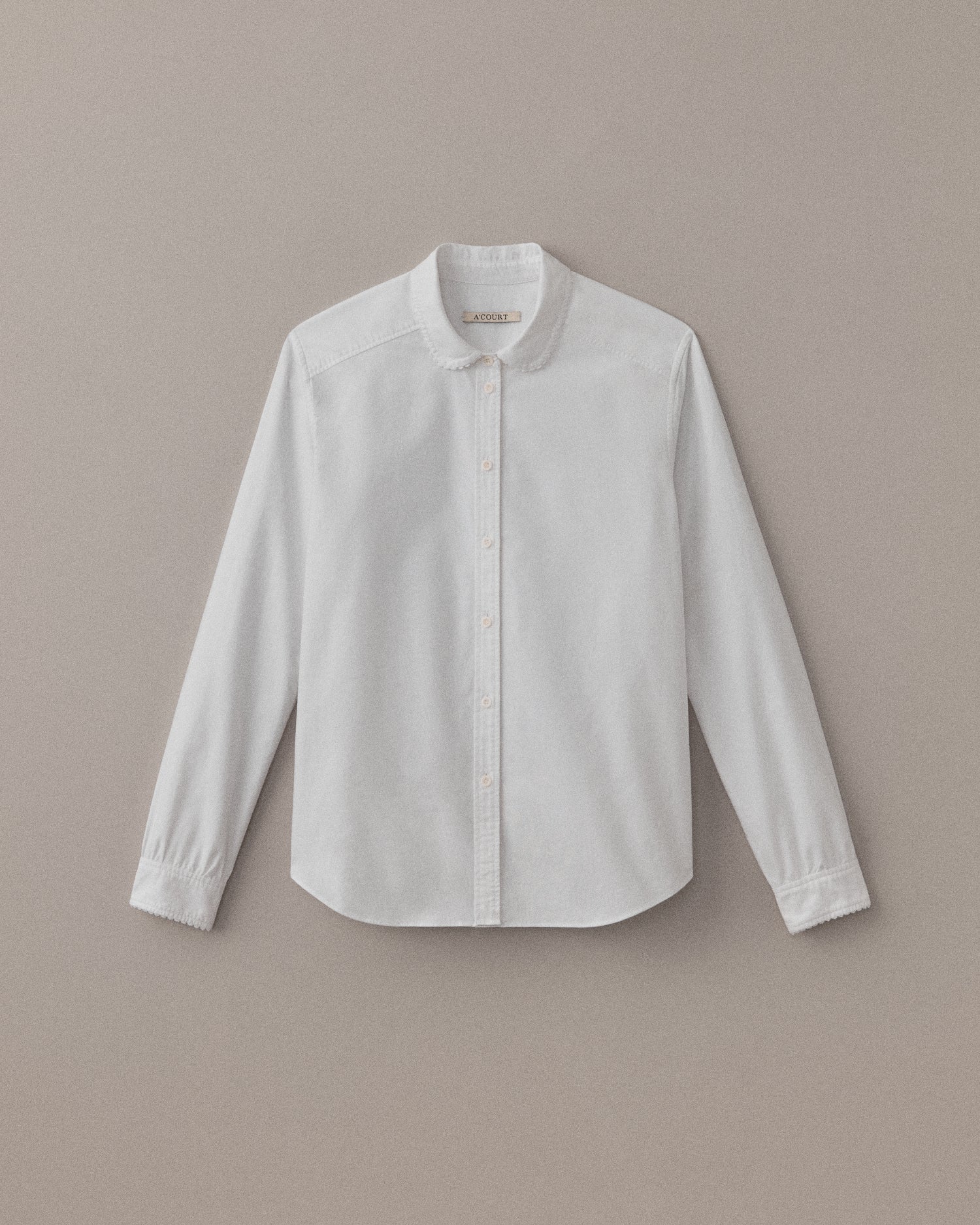 White oxford shirt with scallop trim detail at collar and cuff.